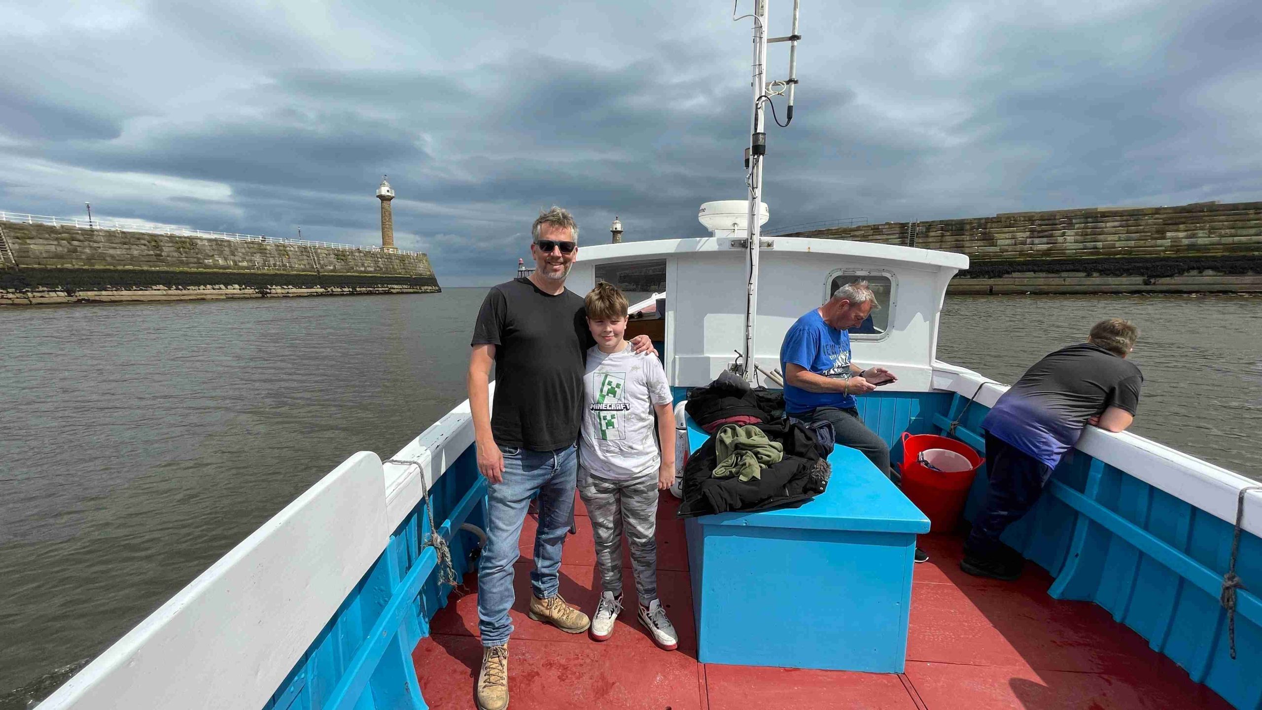 Fishing enthusiasts on a Whitby charter boat with their catch